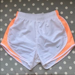 white and orange nike dri-fit shorts
